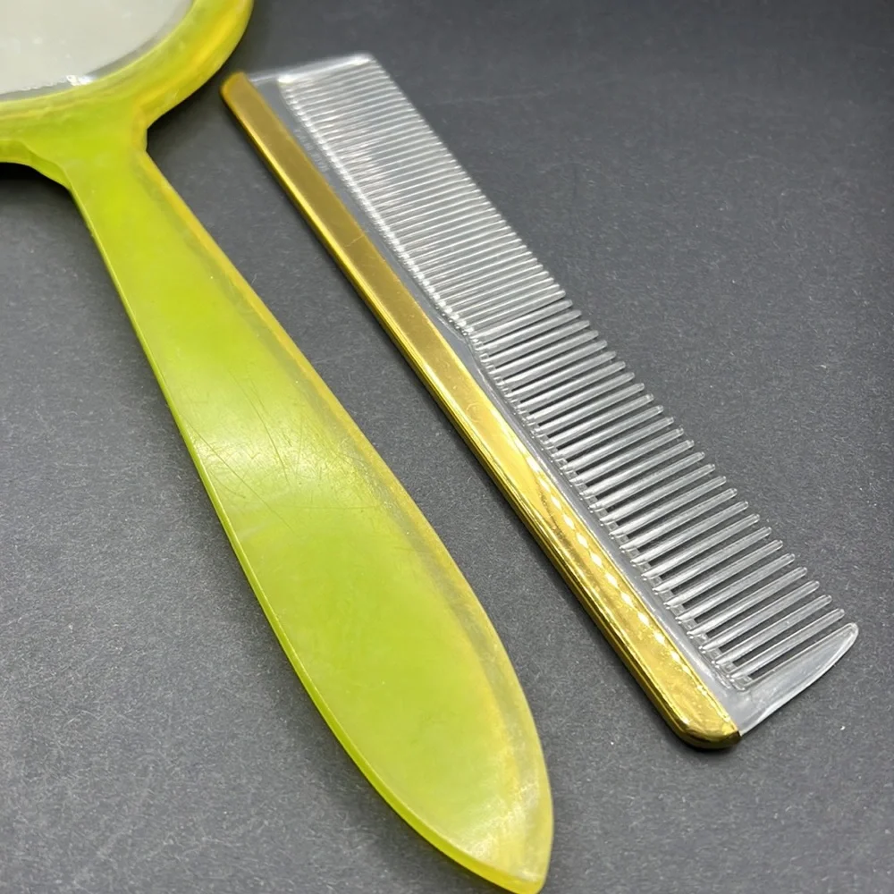 Vintage green celluloid hand mirror and comb set